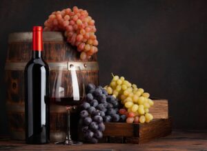 Wine bottle, grapes, glass of wine